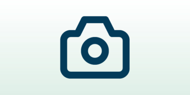 Ein blaues Kamera-Icon auf hellgrünem Hintergrund.